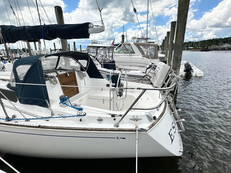 Slide: The Image of 1986 Sabre 30 Sabre MK III sailboat docked at a marina on a sunny day. - 9