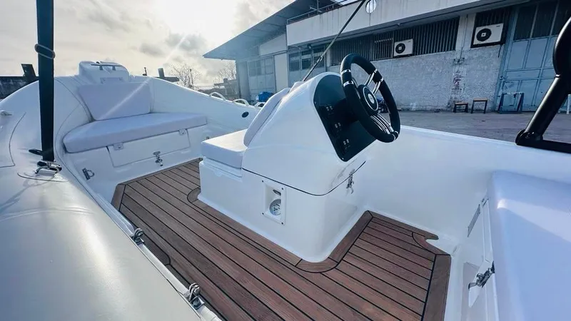Slide: The Image of 2024 Aqvaboats LUXRIB 14 with teak deck and modern steering console. - 17