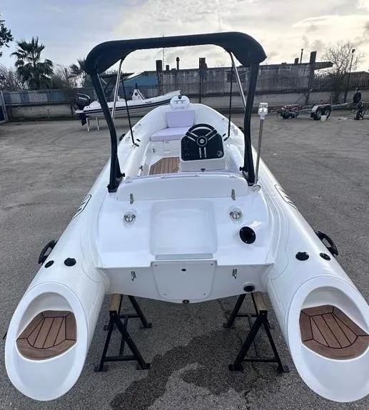 Slide: The Image of 2024 Aqvaboats LUXRIB 14 inflatable boat with a sleek white design and modern features. - 8