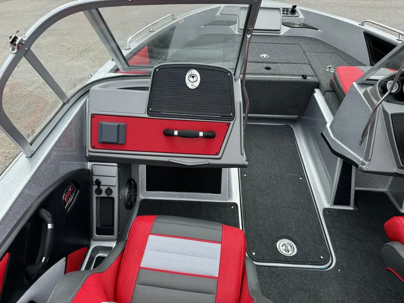 Slide: The Image of 2024 Ranger 1850MS boat interior with red and gray seating, modern dashboard, and spacious layout. - 10