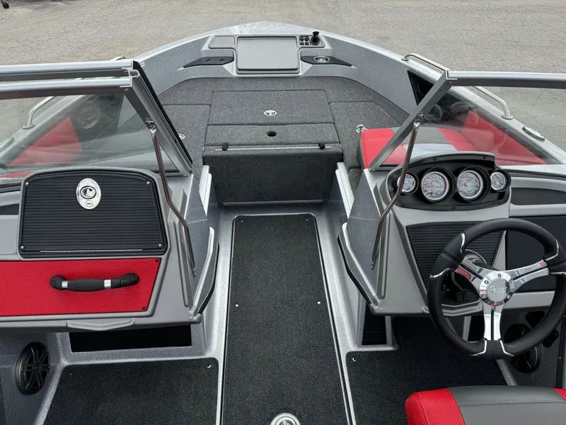 Slide: The Image of 2024 Ranger 1850MS boat interior with red and black seating, steering wheel, and dashboard controls. - 11