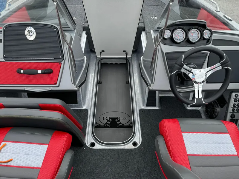Slide: The Image of 2024 Ranger 1850MS boat interior with red and gray seating, steering wheel, and dashboard. - 14