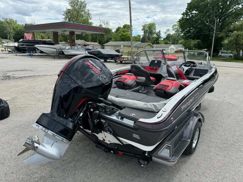 Slide: The Image of 2024 Ranger 1850MS boat with powerful outboard motor, parked outdoors. - 3