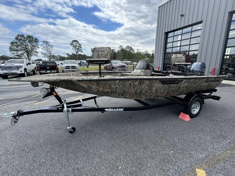 Slide: The Image of 2025 SeaArk Shadow 17 Side Console boat with camouflage design and dual seating. - 6