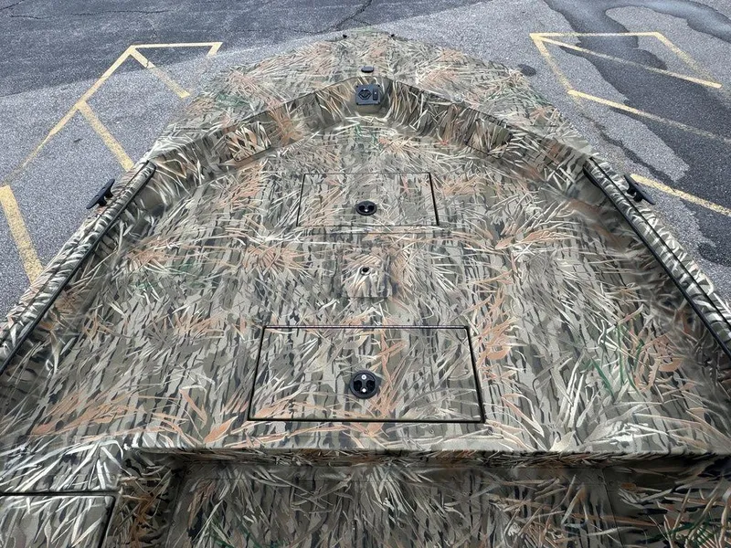 Slide: The Image of 2025 SeaArk Shadow 17 Side Console boat with Yamaha motor in camouflage design. - 8