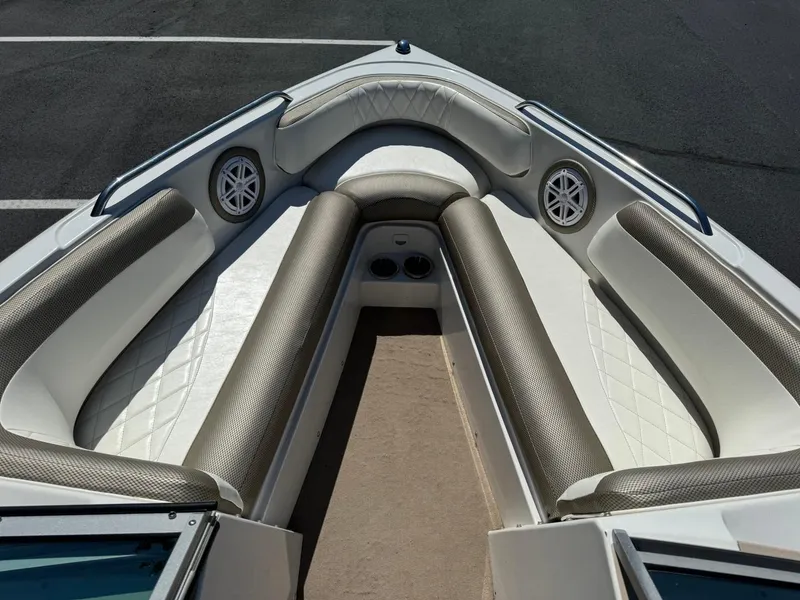 Slide: The Image of 2000 MasterCraft MariStar 230 VRS boat interior with cushioned seating and speakers. - 10