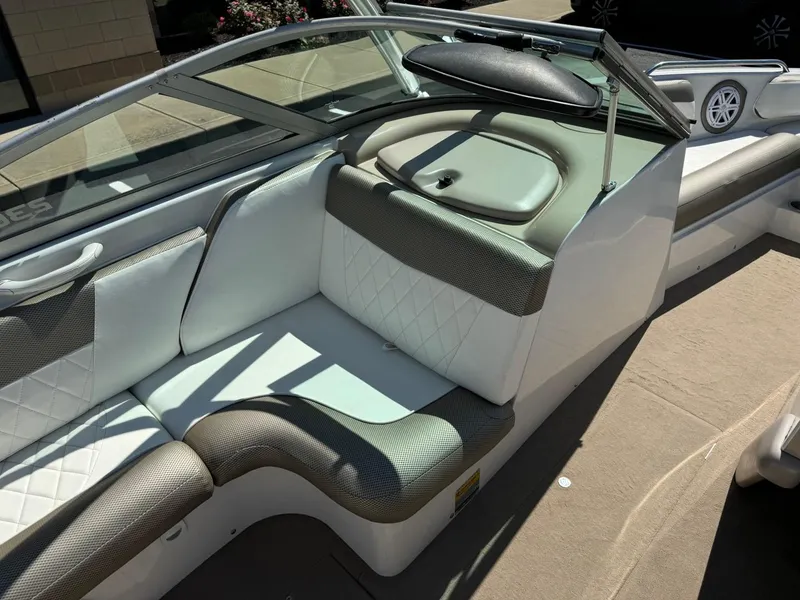 Slide: The Image of 2000 MasterCraft MariStar 230 VRS boat interior with white and gray seating. - 12