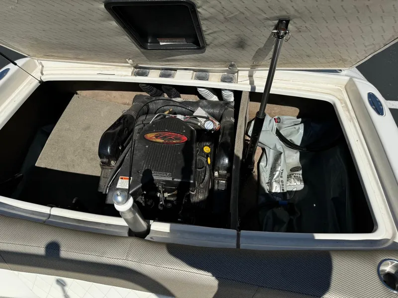 Slide: The Image of 2000 MasterCraft MariStar 230 VRS engine compartment with open hatch. - 17