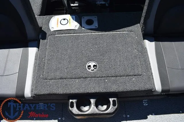 Slide: The Image of 2025 Lund 1775 Adventure SS boat interior with storage compartment and cup holders. - 13