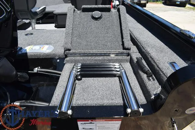 Slide: The Image of 2025 Lund 1775 Adventure SS boat with foldable ladder and carpeted deck. - 19