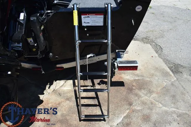 Slide: The Image of Lund 1775 Adventure SS 2025 boat with a foldable ladder at Thayer's Marine. - 20