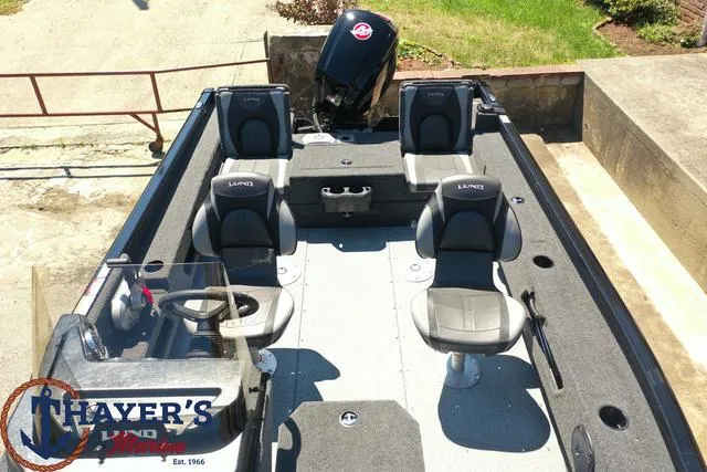 Slide: The Image of 2025 Lund 1775 Adventure SS boat interior with four seats and steering console. - 27