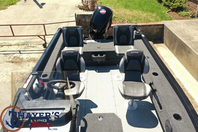 Slide: The Image of 2025 Lund 1775 Adventure SS fishing boat with four seats and a Mercury outboard motor. - 28