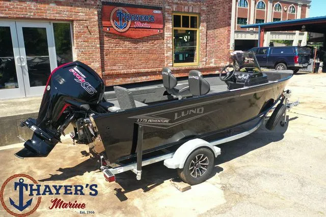 Slide: The Image of 2025 Lund 1775 Adventure SS boat at Thayer's Marine dealership. - 3
