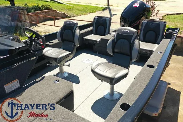 Slide: The Image of 2025 Lund 1775 Adventure SS fishing boat interior with four seats, displayed at Thayer's Marine. - 30