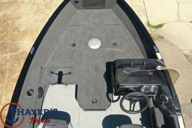 Slide: The Image of 2025 Lund 1775 Adventure SS boat interior with steering console and spacious deck. - 33