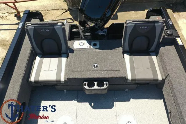 Slide: The Image of 2025 Lund 1775 Adventure SS boat interior with two seats and storage compartments. - 34