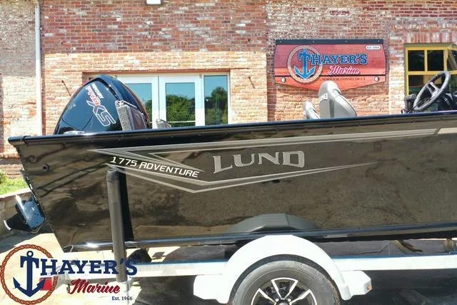 Slide: The Image of 2025 Lund 1775 Adventure SS boat at Thayer's Marine dealership. - 4