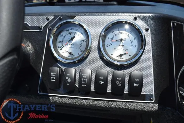 Slide: The Image of Dashboard of 2025 Lund 1775 Adventure SS boat with gauges and control switches. - 7