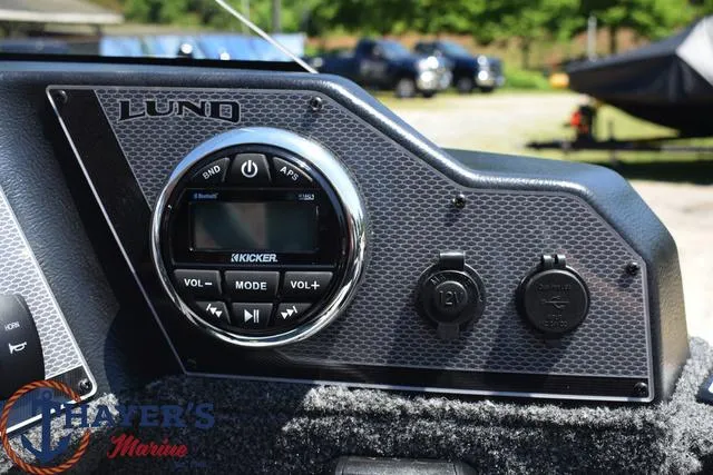 Slide: The Image of Close-up of the 2025 Lund 1775 Adventure SS dashboard with Kicker audio system. - 8