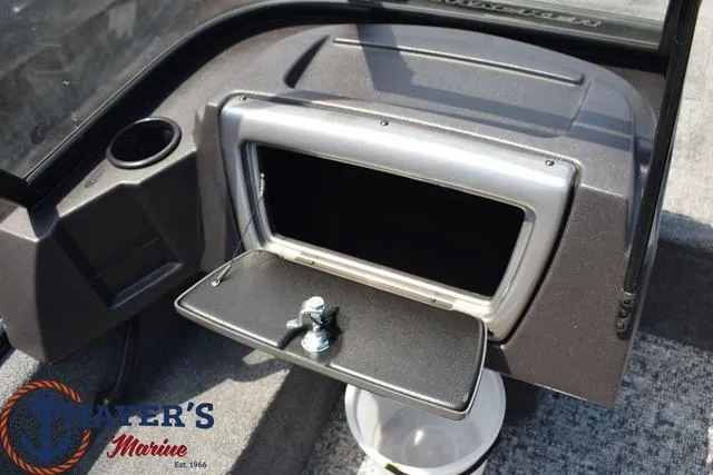 Slide: The Image of 2024 Tracker Pro Guide™ V-16 WT boat dashboard with storage compartment and cup holder. - 10