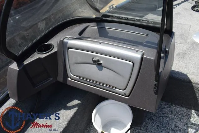 Slide: The Image of 2024 Tracker Pro Guide™ V-16 WT boat interior with storage compartment and Thayer's Marine logo. - 11