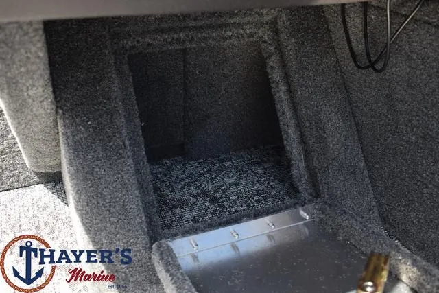 Slide: The Image of 2024 Tracker Pro Guide™ V-16 WT interior storage compartment, Thayer's Marine logo. - 13