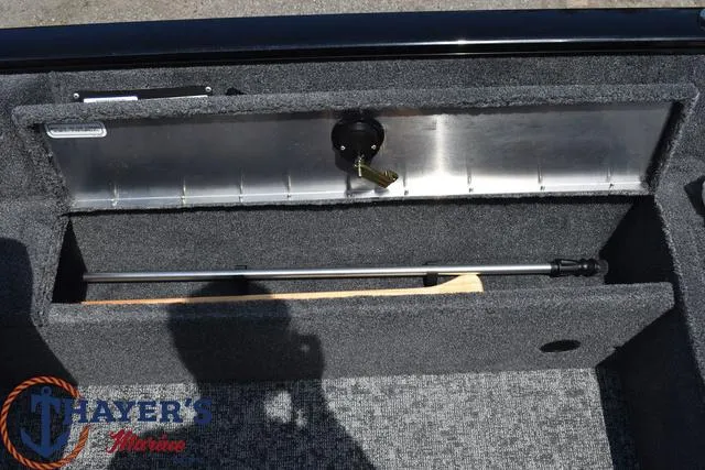 Slide: The Image of 2024 Tracker Pro Guide™ V-16 WT boat storage compartment with rod holder. - 14
