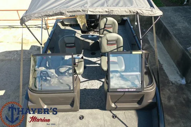 Slide: The Image of 2024 Tracker Pro Guide™ V-16 WT boat with canopy, seating, and Thayer's Marine logo. - 19