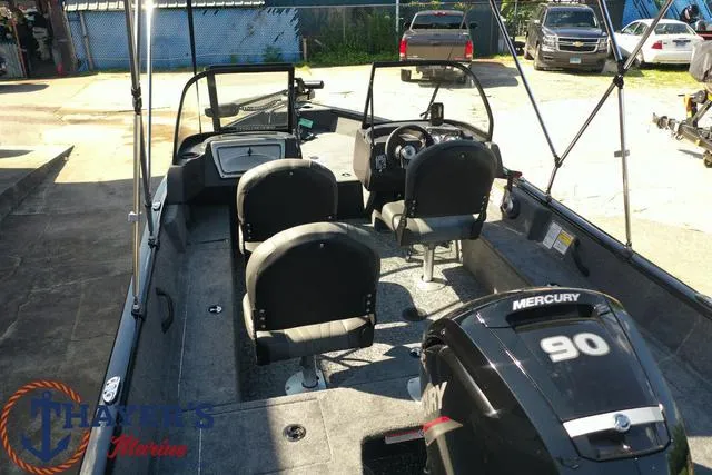 Slide: The Image of 2024 Tracker Pro Guide™ V-16 WT boat interior with Mercury 90 engine. - 31