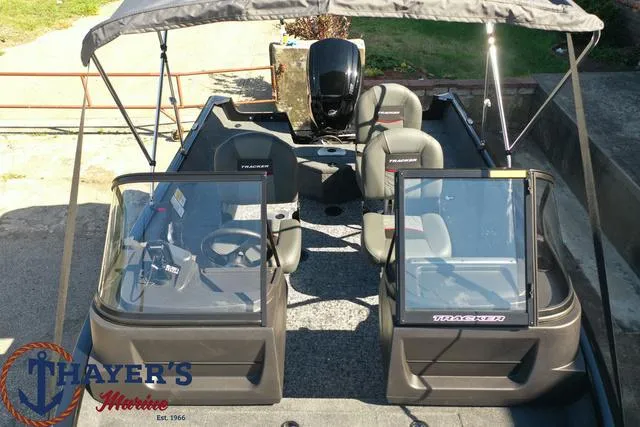 Slide: The Image of 2024 Tracker Pro Guide™ V-16 WT boat interior with seating and console. - 34