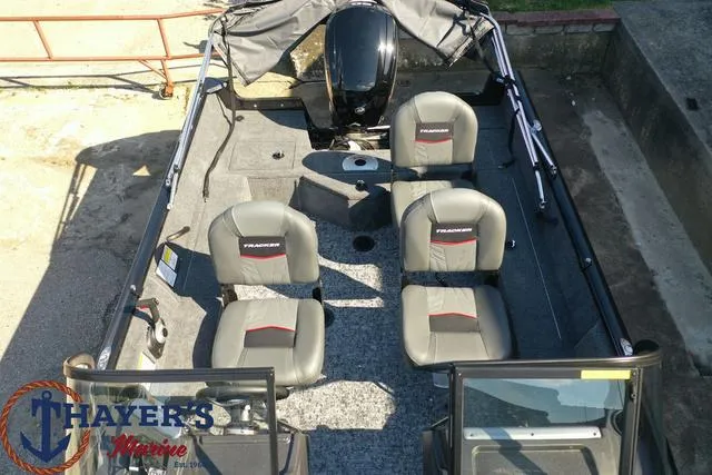 Slide: The Image of 2024 Tracker Pro Guide™ V-16 WT boat interior with four seats, motor, and Thayer's Marine logo. - 37
