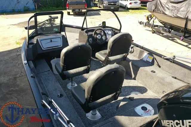 Slide: The Image of 2024 Tracker Pro Guide™ V-16 WT boat interior with seating and dashboard. - 40