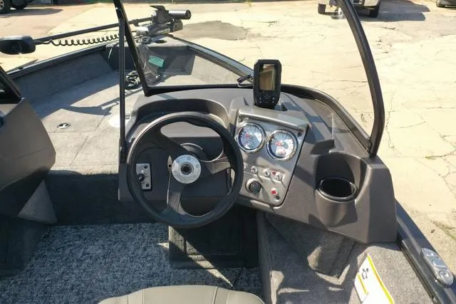Slide: The Image of 2024 Tracker Pro Guide™ V-16 WT boat dashboard with steering wheel and gauges. - 43