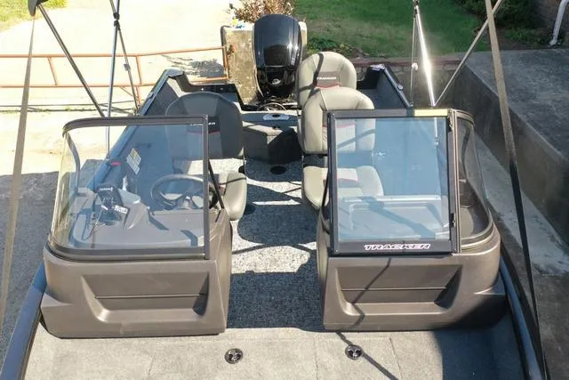 Slide: The Image of 2024 Tracker Pro Guide™ V-16 WT fishing boat interior with dual consoles and seating. - 47