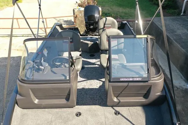 Slide: The Image of 2024 Tracker Pro Guide™ V-16 WT fishing boat interior with dual consoles and seating. - 48