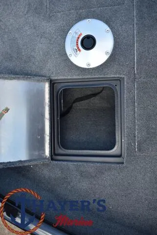 Slide: The Image of 2024 Tracker Pro Guide™ V-16 WT boat storage compartment and seat base. - 6