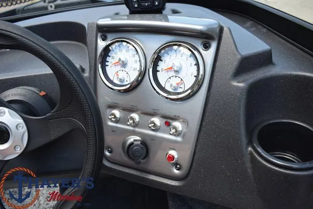 Slide: The Image of 2024 Tracker Pro Guide™ V-16 WT dashboard with gauges and controls. - 8