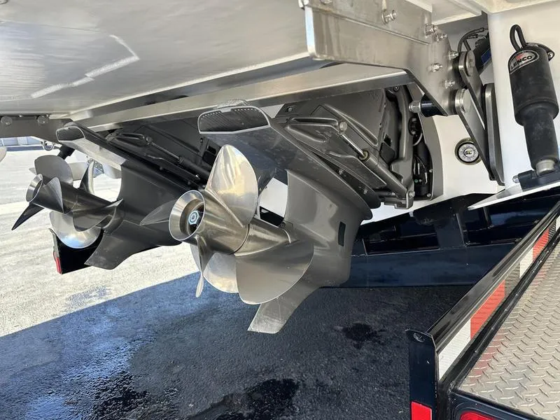 Slide: The Image of Cobalt R33 2023 boat propellers and stern drive on a trailer. - 11