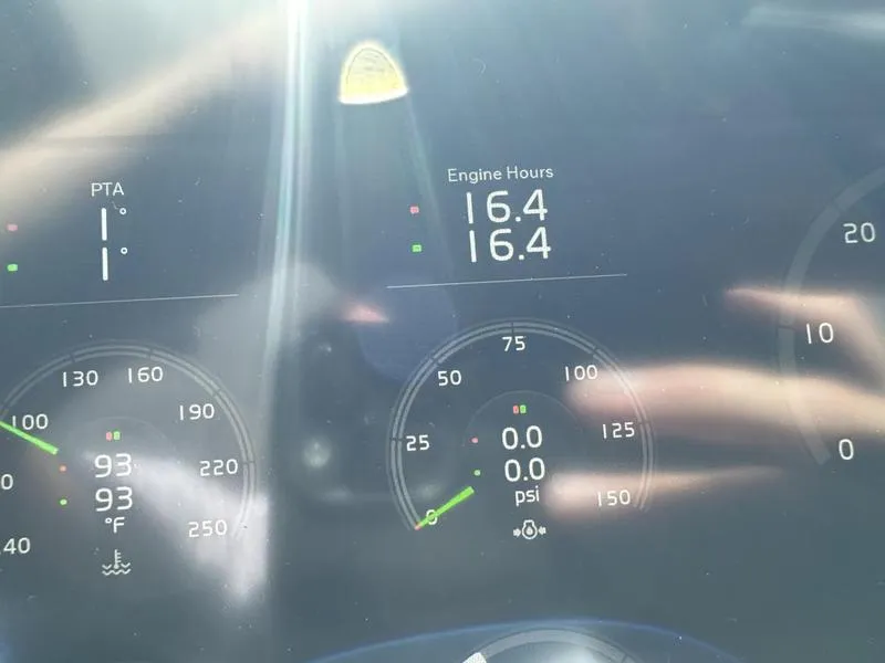 Slide: The Image of Dashboard of 2023 Cobalt R33 showing engine hours and temperature gauges. - 12