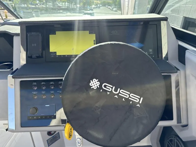 Slide: The Image of Cobalt R33 2023 dashboard with Gussi Italia steering wheel cover, featuring modern controls and displays. - 16