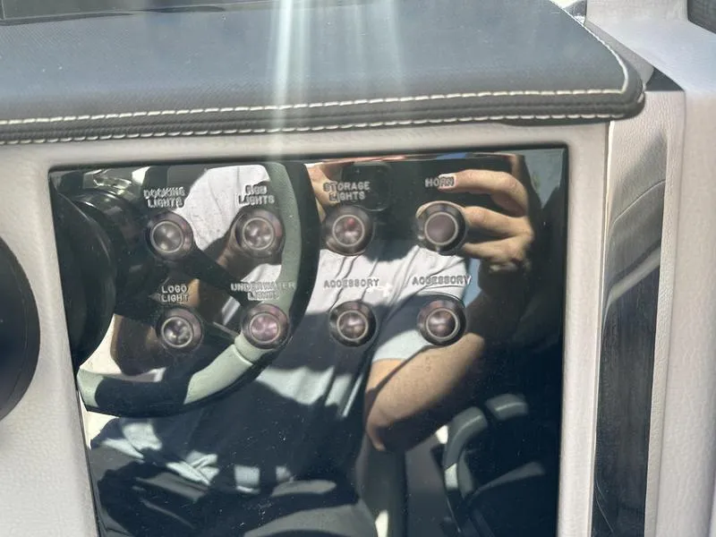 Slide: The Image of Control panel of 2023 Cobalt R33 with various labeled buttons and reflections. - 20