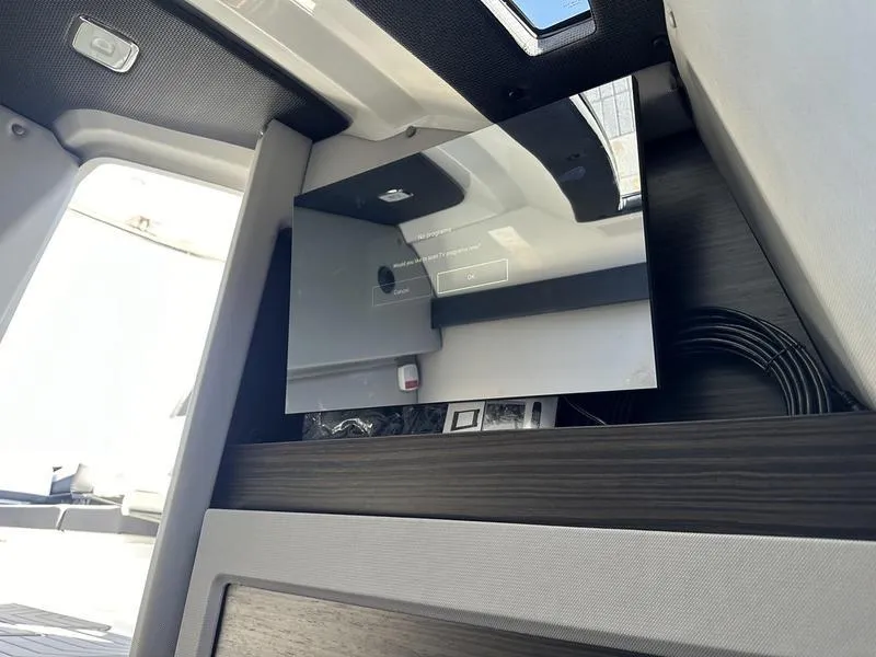 Slide: The Image of 2023 Cobalt R33 interior with sleek modern design and reflective surfaces. - 22