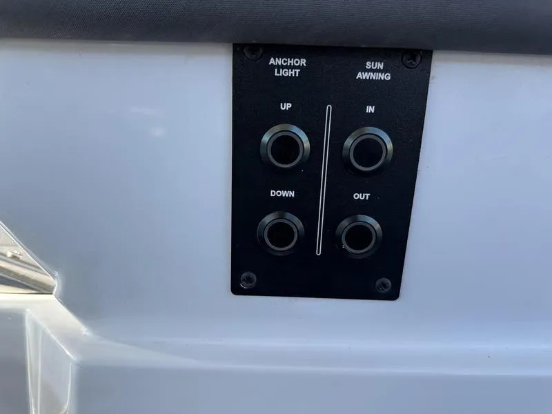 Slide: The Image of Control panel on 2023 Cobalt R33 boat for anchor light and sun awning. - 30