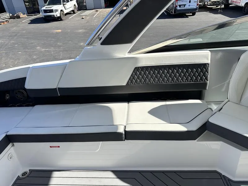 Slide: The Image of 2023 Cobalt R33 boat interior with white leather seating and diamond-patterned accents. - 32