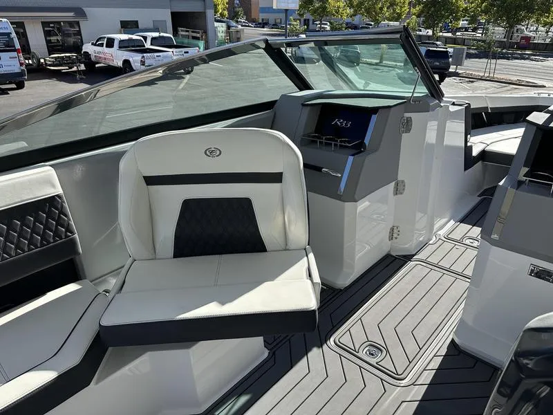 Slide: The Image of 2023 Cobalt R33 boat interior with modern seating and dashboard. - 34