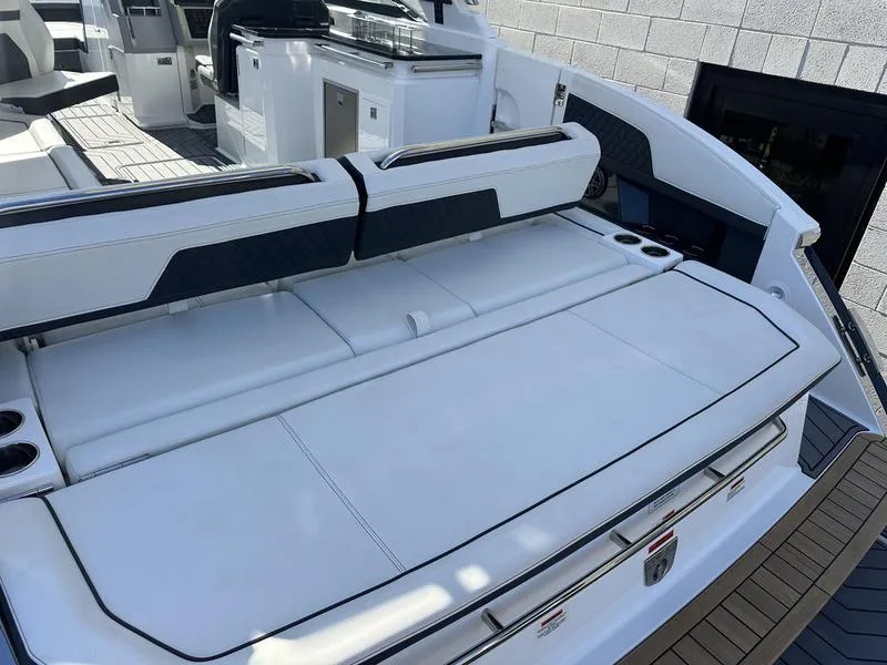 Slide: The Image of 2023 Cobalt R33 boat interior with white seating and modern design. - 35
