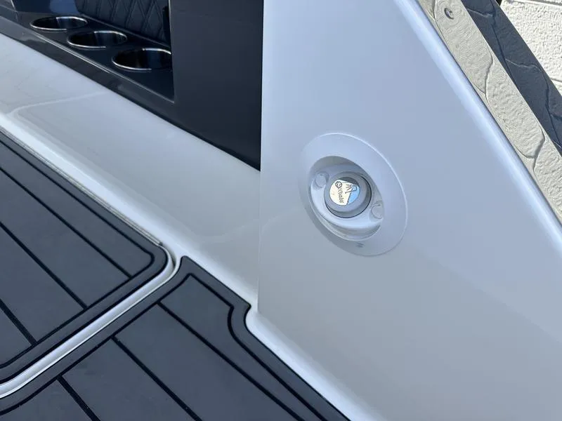 Slide: The Image of 2023 Cobalt R33 boat deck with cup holders and sleek design. - 38