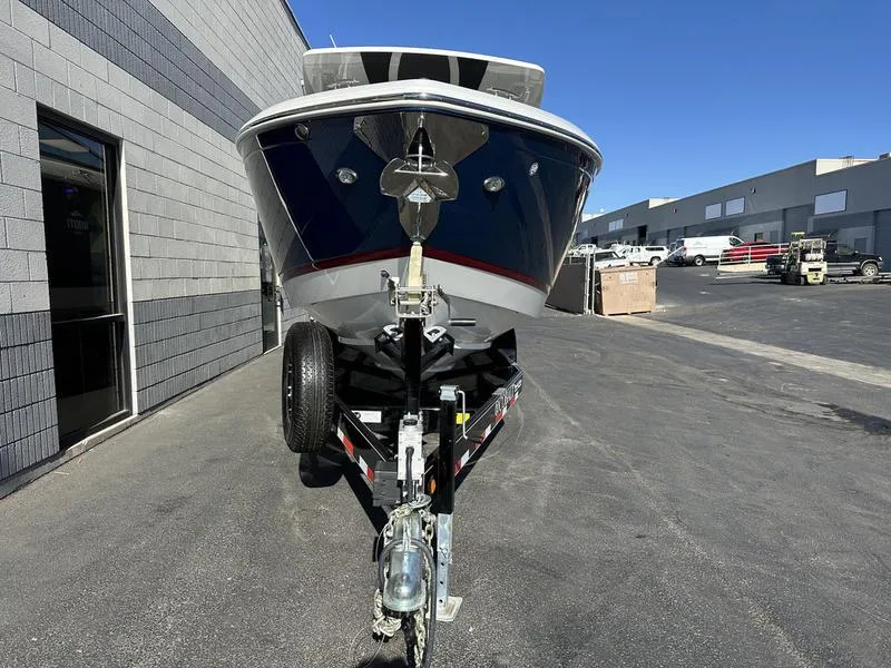 Slide: The Image of 2023 Cobalt R33 boat on trailer in industrial area. - 4