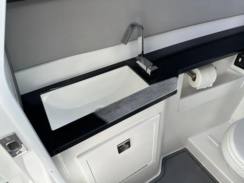 Slide: The Image of Modern bathroom sink in 2023 Cobalt R33 boat with sleek faucet and storage. - 42